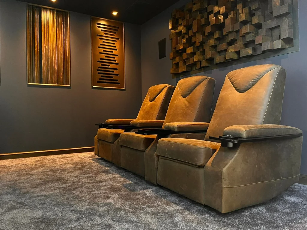 Home theatre acoustic treatment with side-wall absorption panels and corner bass traps