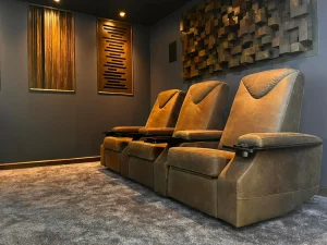 Home theatre acoustic treatment with side-wall absorption panels and corner bass traps